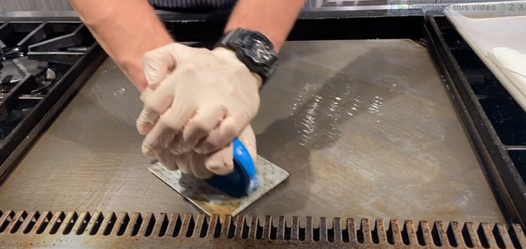 Rinse the griddle surface with clean water to remove residue