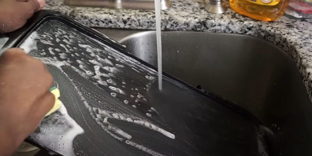 Use a damp cloth or sponge to wipe down the surface of the griddle